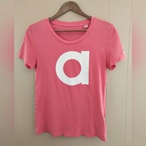 Adidas short sleeve tee, salmon, letter a graphic on front, size small